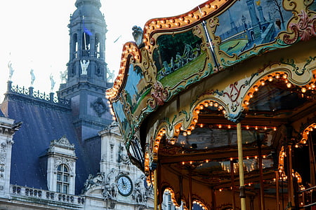 carousel behind white painted baroque building
