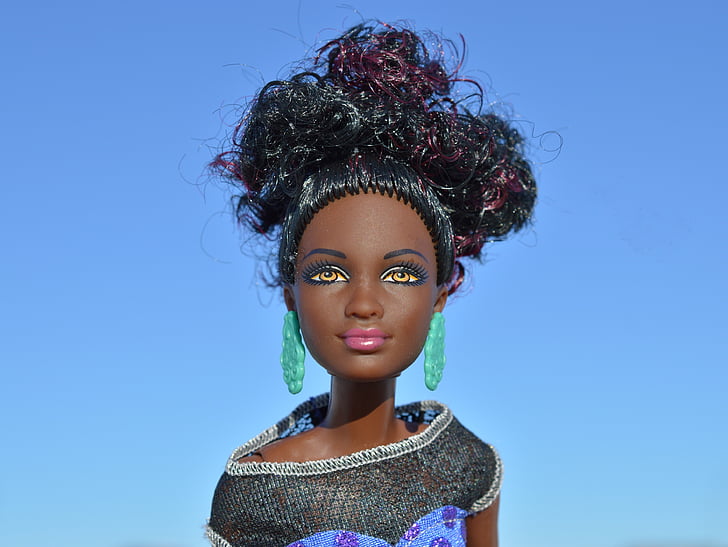 Barbie doll wearing gray top