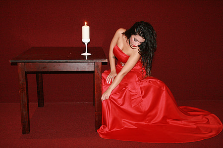 woman wears red strapless dress