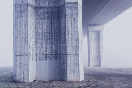 low angle photo of white concrete bridge