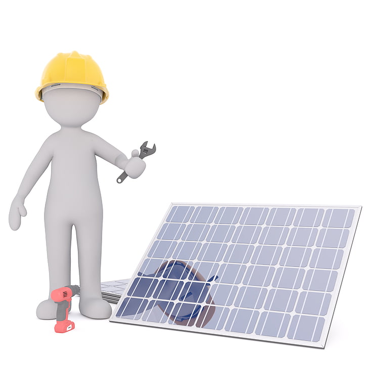 man holding adjustable wrench while standing beside solar panel
