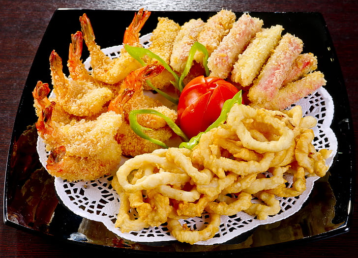 tempura, green vegetable, and calamari on brown table