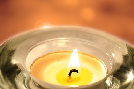 photo of yellow candle tealight