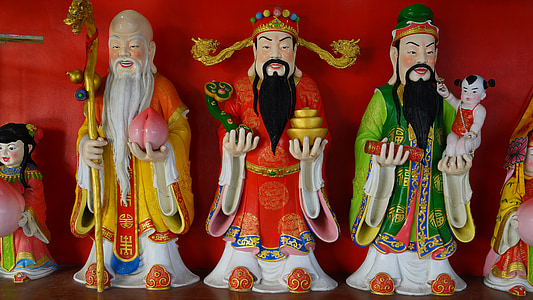 Oriental figurines on board