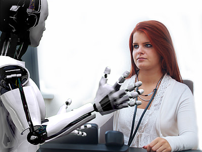 woman in white cardigan in front of robot