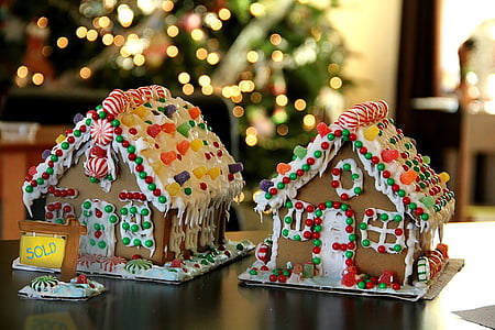 two ginger bread houses on brown tables