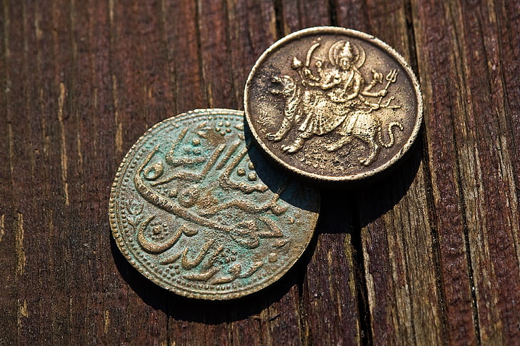 two round bronze-colored Indian rupee coins