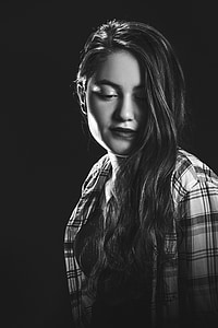 woman in plaid sport shirt grayscale portraiture photography