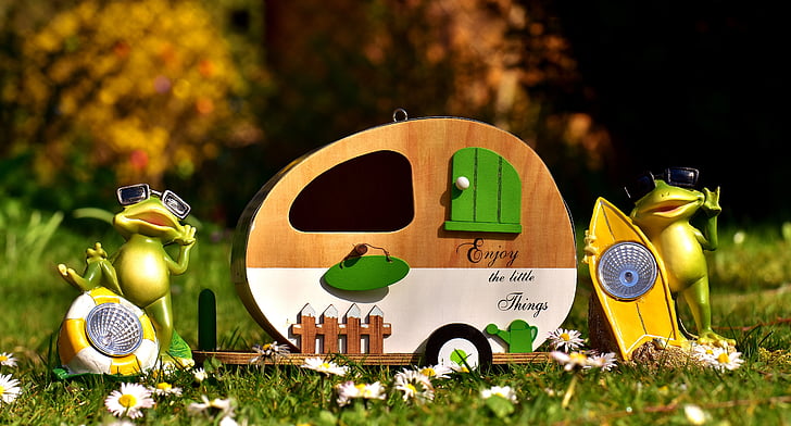 trailer with frog figurines garden decors