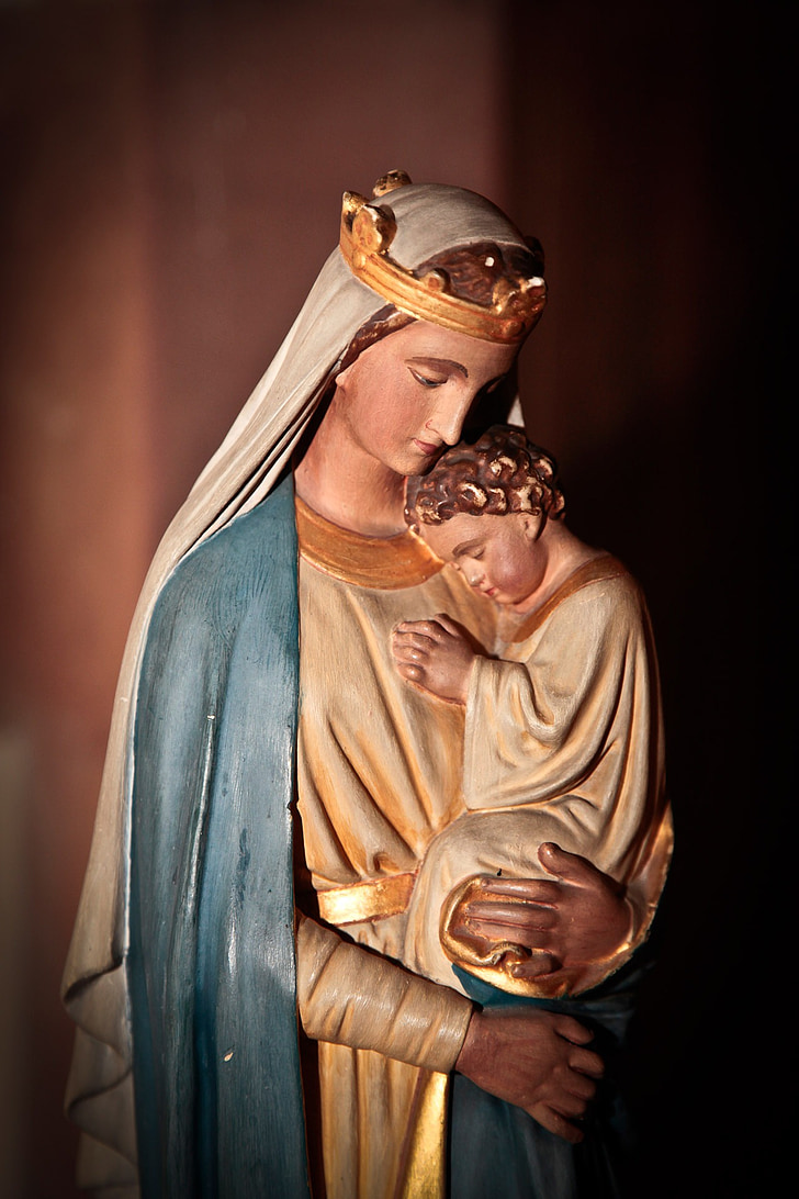 shallow focus photography of Virgin Mary statuette