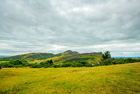 landscape photography of hills surrounded by trees