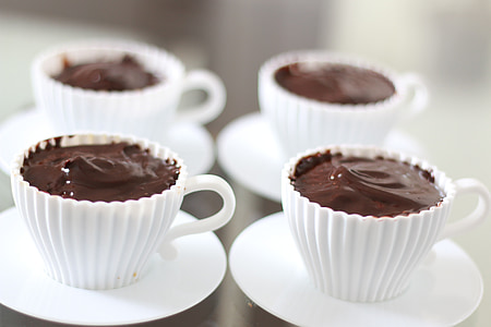 chocolate drink in four white cups