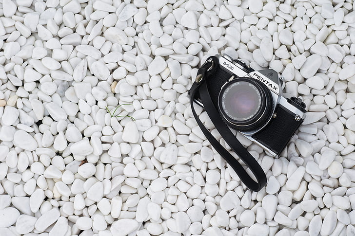 black and silver Pentax camera