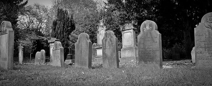 grayscale of photo of tomb stone