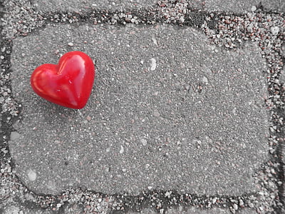 red heart on concrete surface