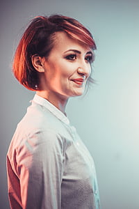 short brown haired woman wearing white collared top