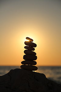 silhouette photography of stone balancing