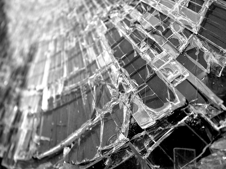 grayscale close up photography of crushed glass