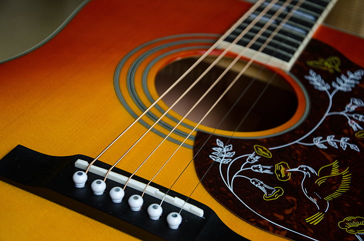 brown dreadnought acoustic guitar