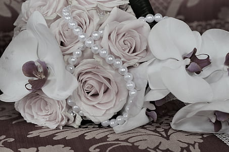 white flower bouquet on gray textile