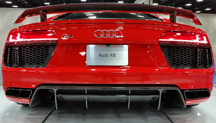 red Audi coupe on white flooring