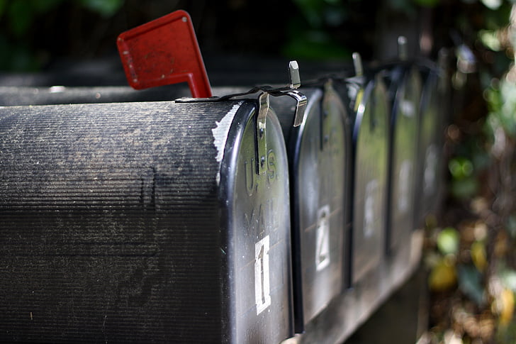 close up photo of black mailboxes