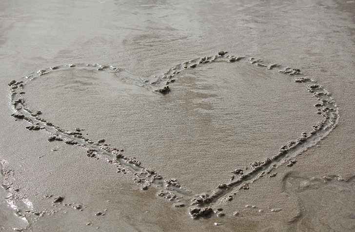 heart drawn on sand