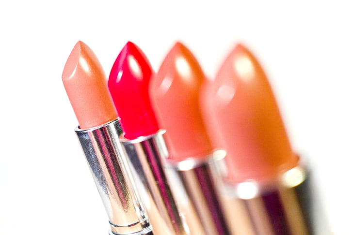 Royalty-Free photo: Four assorted lipsticks | PickPik