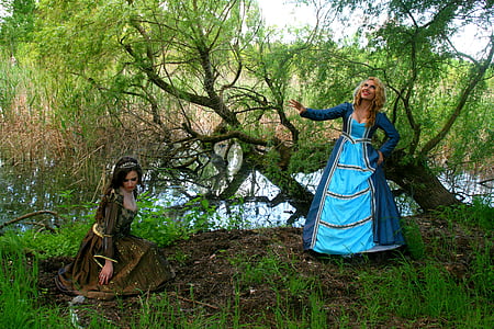 woman in blue dress near river