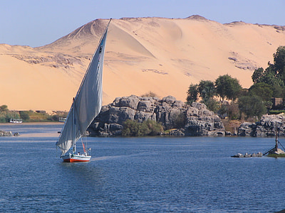 white sailboat near desert at daytime