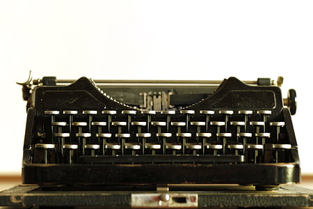 vintage black typewriter on brown top