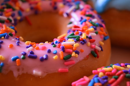 close-up photo of doughnut with sprinkles