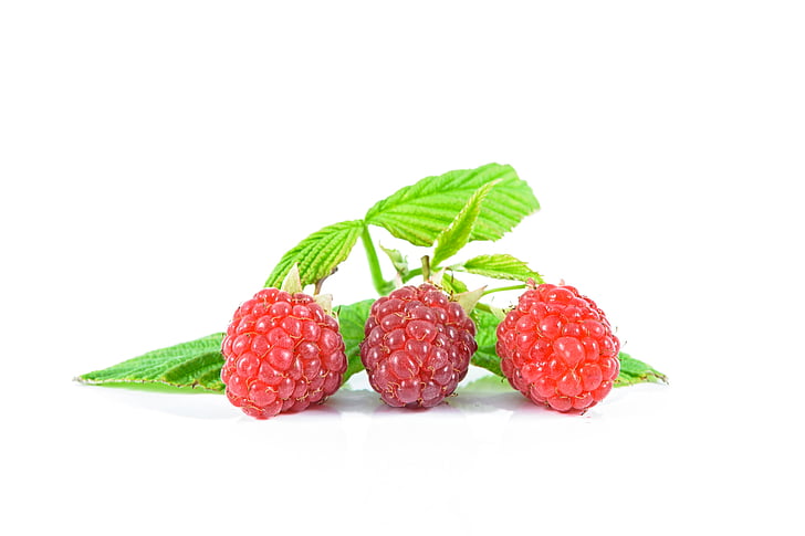 three red raspberry fruits