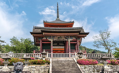red and black pagoda temple at daytime