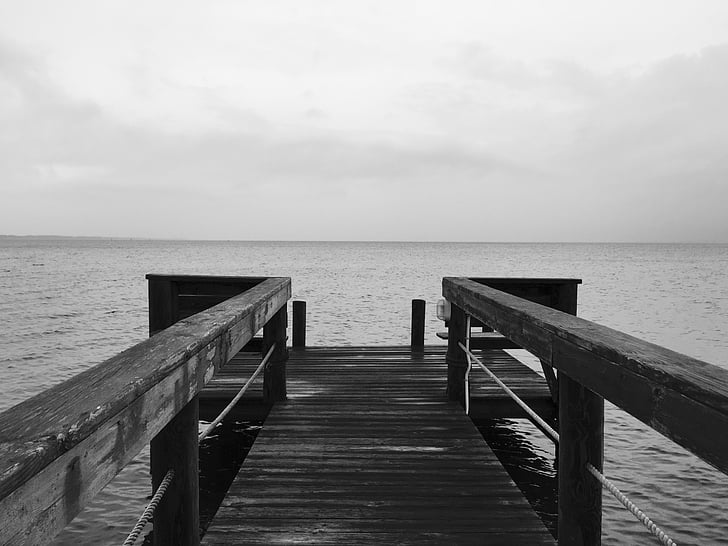 grayscale photography of boardwalk