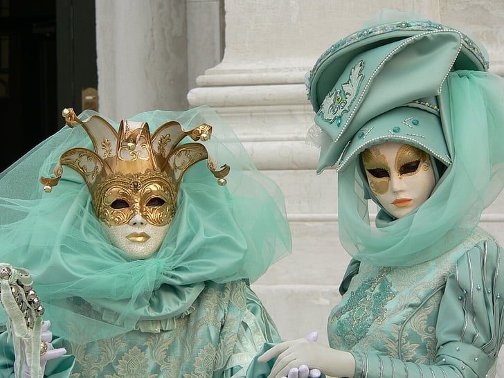 two person wearing masquerade masks