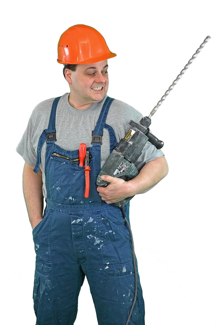 man holding corded power tool
