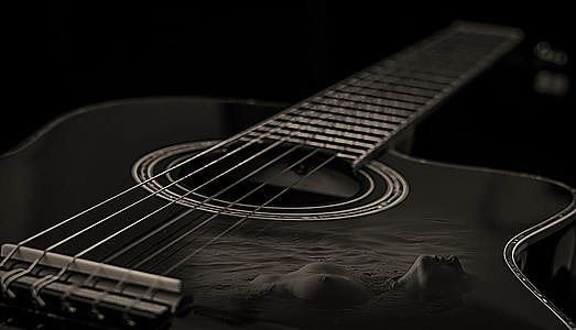 black single cutaway acoustic guitar