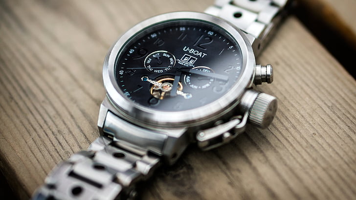 selective focus photography of round black U-Boat chronograph watch with at 5:15