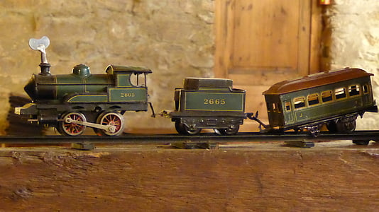 photography of grain steam locomotive train toys
