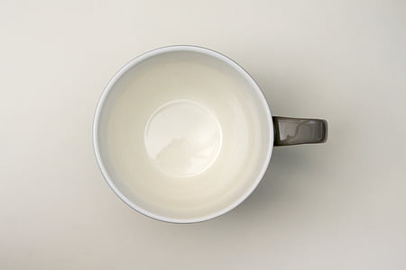 white and gray ceramic mug