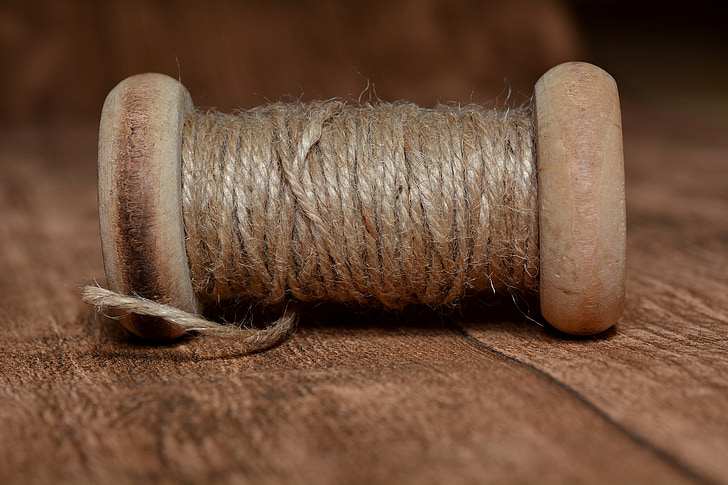 Royalty-Free photo: Brown thread spool in closeup photography
