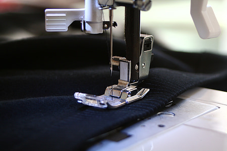 close-up photography of white electric sewing machine