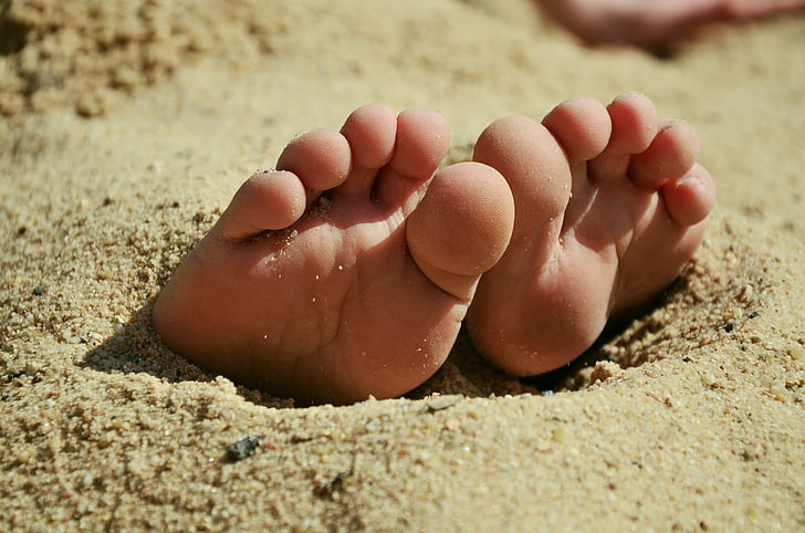 feet under the sand