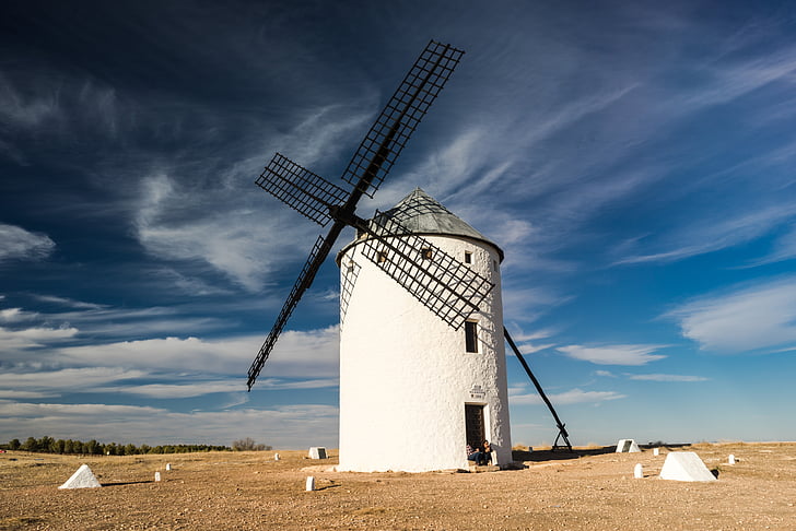 white and black windmill on desert