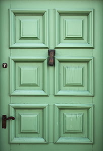 closeup photo of green 6-panel door