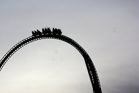 silhouette photography of roller coaster on top