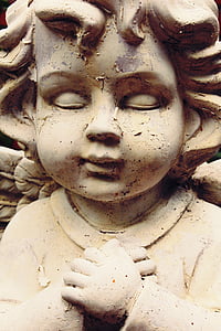 statue of brown child
