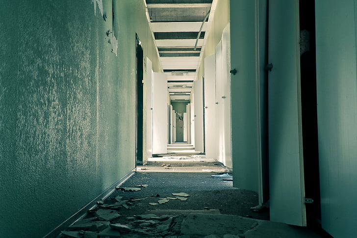 focus photo of gray concrete hallway