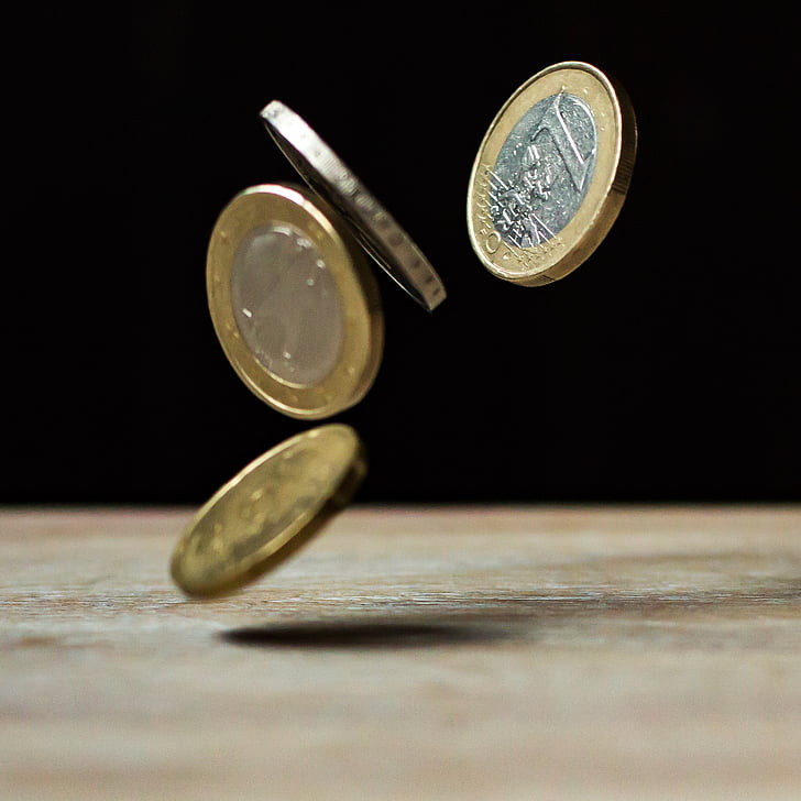 closeup photography of falling coins